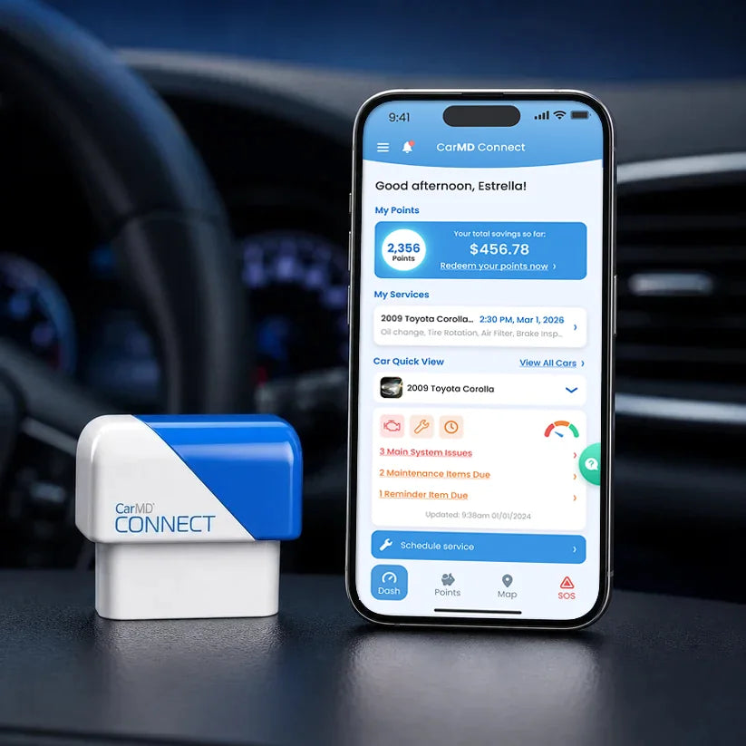 CarMD Connect beside a phone running the CarMD Connect app, on a car dashboard